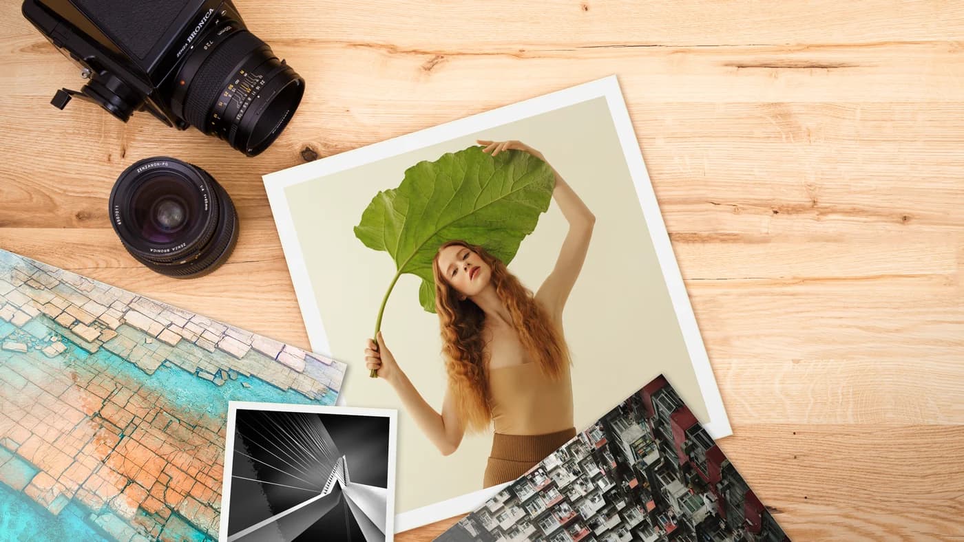 Diferentes papéis e acabamentos fotográficos sobre uma mesa